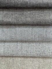 Fabric swatches in different colors, upholstery material for furniture. Samples of fabrics