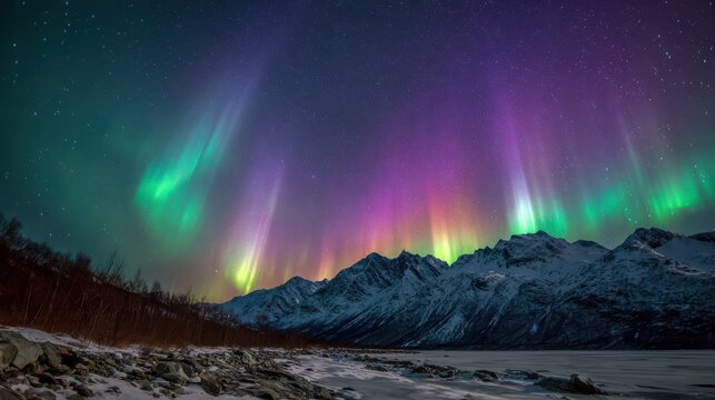 Vibrant aurora borealis lights up starry night sky over snow covered mountains northern - Powered by Adobe