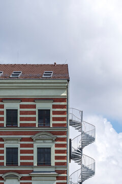 Architecture uses stairs and staircase carved into structure so that geometry and design stay visible, while minimalism frames architectural detail inside urban space and modern building