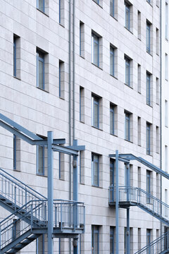 Geometry and design in architecture arrange stairs and staircase along a structure where minimalism supports architectural detail between urban space and modern building