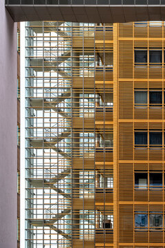 Stairs and staircase rise through architecture, turning structure into a play of geometry and design, with minimalism clarifying architectural detail across layered urban space and modern building