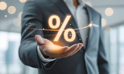 Boost your business with high interest rates and financial gains with this professional businessman showing a glowing percentage sign and upward arrow in his hand