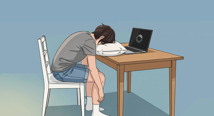Young man sleeping on a pillow at a wooden desk with an open laptop displaying a loading icon, indicating exhaustion or overwork.
