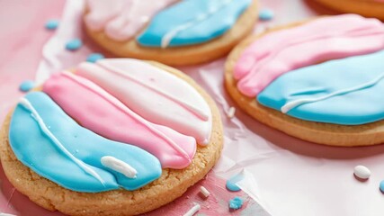 Colorful iced cookie on pink background with sprinkles around - Powered by Adobe