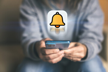 Responding to a New Alert A Woman Smiles While Checking an Important Notification Indicated by a Bell Icon