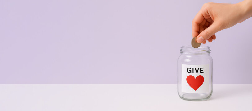 Giving tuesday donation concept with coin in jar, background