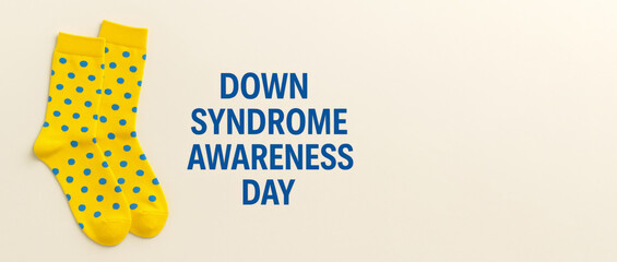 Down syndrome awareness day concept with yellow polka dot socks on light background