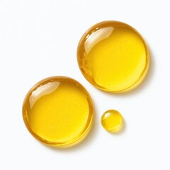 Golden Oil Drops on White Background