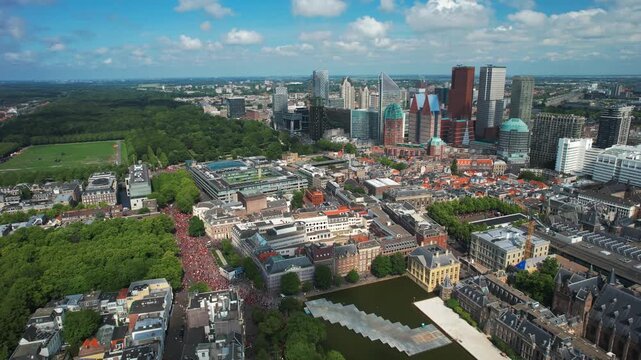 The Hague Skyline view of Free Palestine mass protest, aerial shows massive group of protesters around Dutch Parliament Tweede Kamer in The Hague, Netherlands