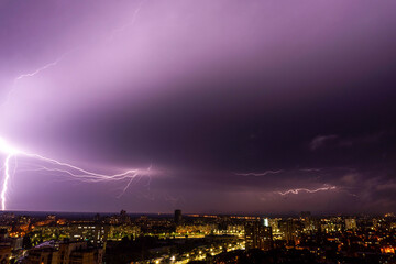 thunderstorm and lightning over the night city