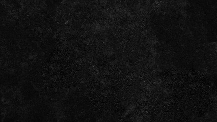 A dark, textured abstract background with a grainy, speckled surface resembling a close-up of a rough material.