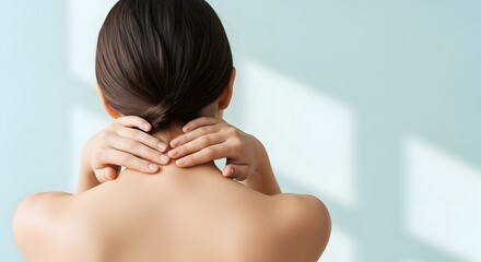 Woman massage her painful neck due to muscle tension or injury, providing relief for discomfort and stress. Concept of self care and wellness.