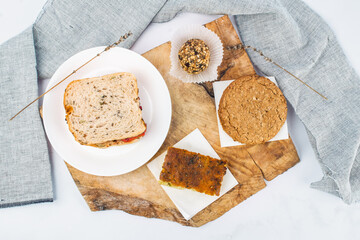 Healthy Organic Lunch Plate With Sandwich and Whole Food Snacks. Useful for promoting healthy eating, balanced diet, wellness content and organic food.