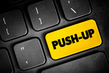 Naklejka premium Push-up is a common calisthenics exercise beginning from the prone position, text button on keyboard, concept background