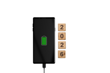Smartphone Charging Concept with 2026 New Year Wooden Blocks