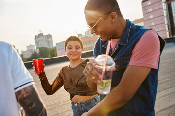 Young friends enjoy a vibrant rooftop party filled with laughter and joy