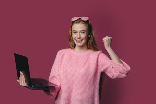 energetic woman in striking attire celebrates successfully conquering challenges associated with telecommuting