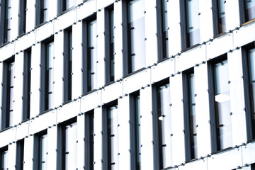 Modern architecture facade rendered with geometric pattern, structure, lines, minimalism and contrast to convey clean urban commercial concepts with clarity, balance and refined visual structure