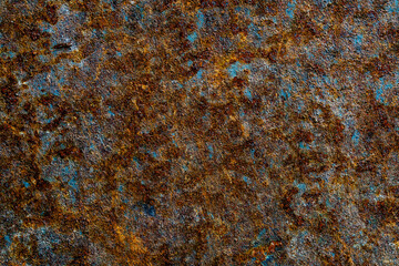Abstract background with old rusty metal surface, closeup. Orange worn rusty metal texture