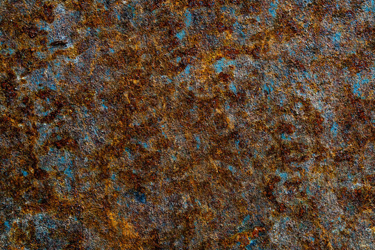 Abstract background with old rusty metal surface, closeup. Orange worn rusty metal texture