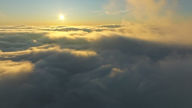 Sunrise illuminates broad skyscape, Daybreak reveals vast cloud formations gracefully, Early morning rays softly highlight extensive cloudcovered horizon scene