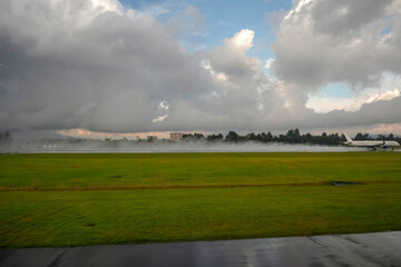 bogota airport landing and taking off strip under the rain