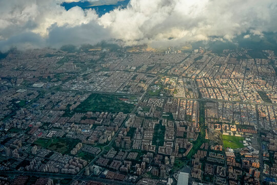 bogota aerial view from airplane window at sunset - Powered by Adobe