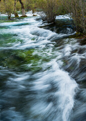 Long Exposure of Rushing Water in the Scenic Mountain Stream, Jiuzhaigou National Park, China.