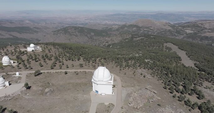 Aerial drone shot towards Calar Alto Observatory in the Sierra de Los Filabres mountain range in Almeria, Andalusia, Spain. Largest astronomical observatory in Europe. Shot in ProRes 422 HQ
