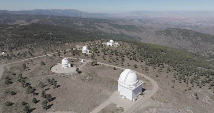 Aerial drone shot towards Calar Alto Observatory in the Sierra de Los Filabres mountain range in Almeria, Andalusia, Spain. Largest astronomical observatory in Europe. Shot in ProRes 422 HQ