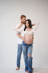 Couple sharing a tender moment before baby arrives