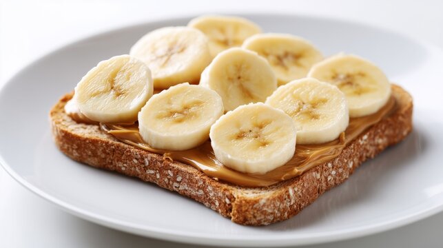 Whole wheat toast topped with creamy peanut butter and fresh banana slices for an energetic breakfast for sporty people