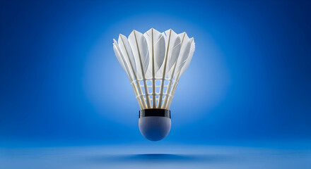 Close-up shot of a white and yellow badminton shuttlecock on a blue background.
