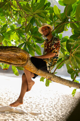 Man laying on tree., nusa penida, bali. High quality photo