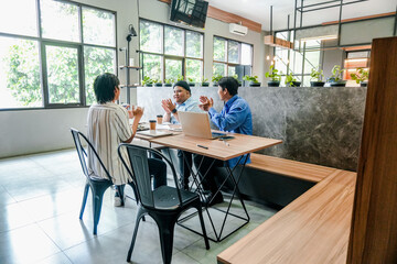 Diverse Team Celebrates Successful Project Completion Clapping