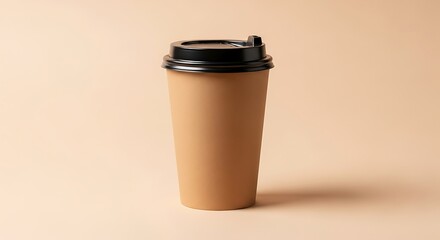 Tall to go coffee cup with black lid on a light peach background