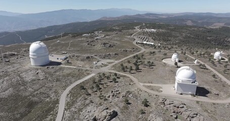 Aerial drone shot towards Calar Alto Observatory telescopes in the Sierra de Los Filabres mountain range in Almeria, Andalusia, Spain. Largest astronomical observatory in Europe. Shot in ProRes 422 HQ