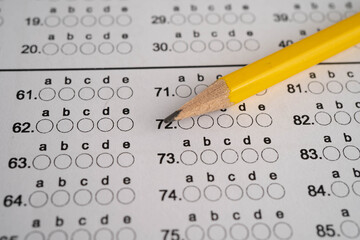 Answer sheets with pencil drawing fill to select choice, education.