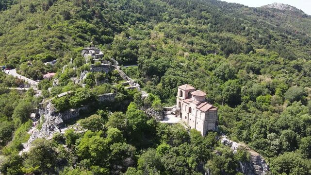 Aerial Spring view of Church of the Holy Mother of God at ruins of Medieval Asen Fortress, Asenovgrad, Plovdiv Region, Bulgaria