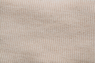 close-up of beige ribbed fabric, perfect for backgrounds and textures