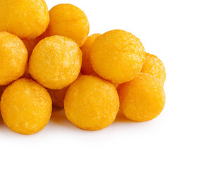 Delicious yellow cheese balls stacked in a tasty pile for snacking
