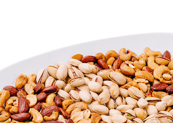 Mixed nuts display on a white plate with various types of nuts highlighted