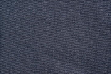 Close-up of dark blue fabric texture with subtle woven pattern