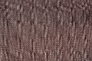 Close-up of a textured brown fabric with a woven pattern, perfect for backgrounds