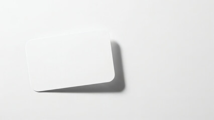 A blank white card with rounded corners casts a subtle shadow on a plain white background