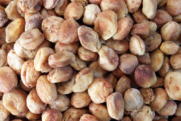 Natural dried apricots background top view macro