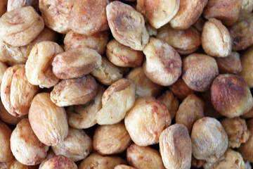 Natural dried apricots background top view macro