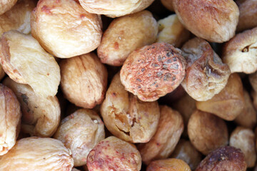 Natural dried apricots background top view macro