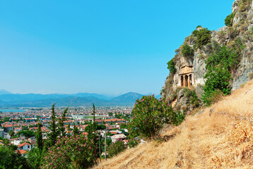 Tomb of Amyntas, ancient Lycian rock tombs with Fethiye cityscape at background