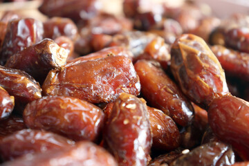 Dates fresh close up highlighting smooth shiny surfaces of tightly packed soft dates